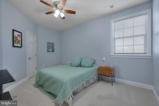 carpeted bedroom with ceiling fan