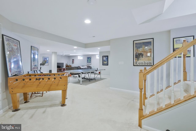 recreation room featuring light colored carpet