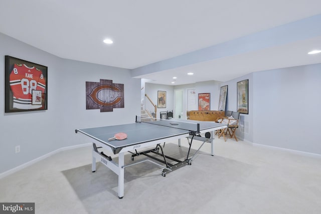 recreation room featuring light colored carpet