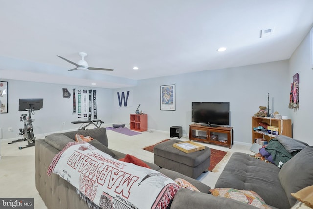 carpeted living room featuring ceiling fan