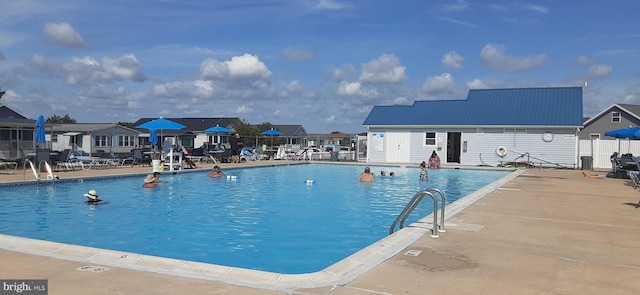 view of pool featuring a patio