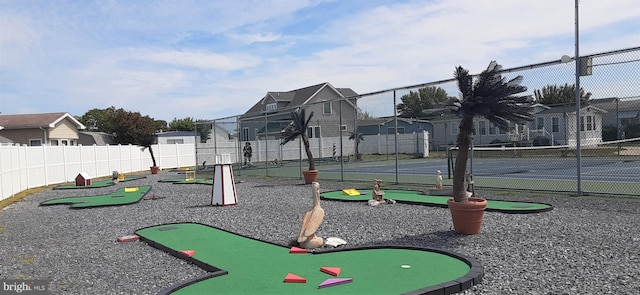 view of play area featuring tennis court