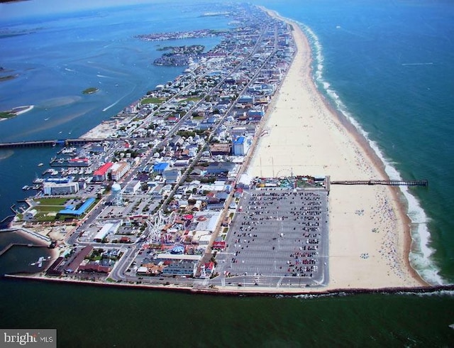 bird's eye view with a water view and a view of the beach