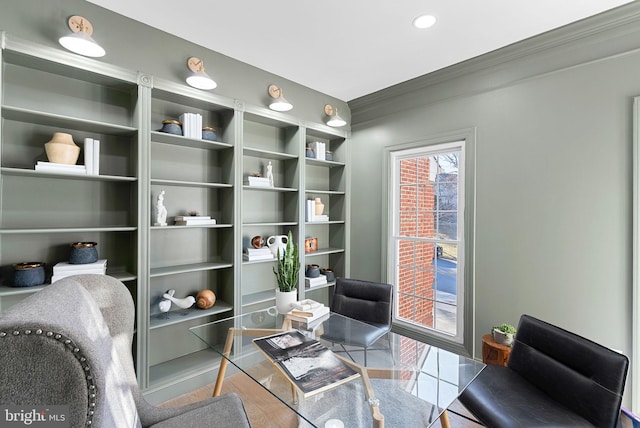 living area featuring crown molding