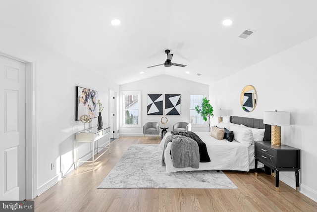 bedroom with lofted ceiling, light hardwood / wood-style flooring, and ceiling fan