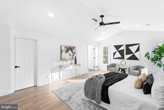 bedroom featuring vaulted ceiling, ceiling fan, and light wood-type flooring