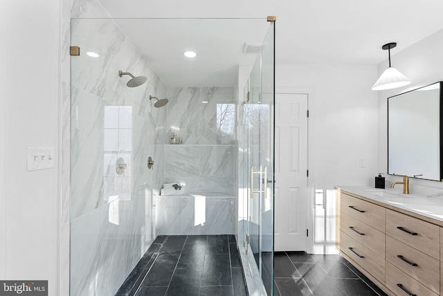 bathroom featuring a shower with door, vanity, and tile patterned floors