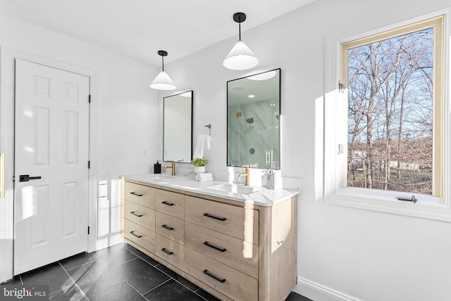 bathroom featuring walk in shower, plenty of natural light, and vanity