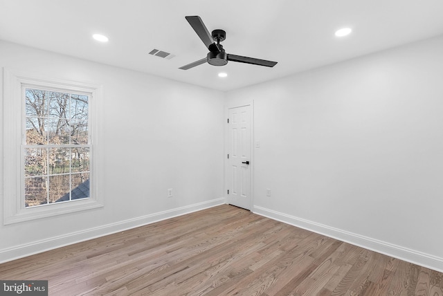 unfurnished room featuring ceiling fan and light hardwood / wood-style flooring