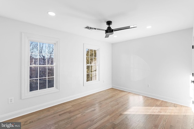 spare room featuring ceiling fan and light wood-type flooring