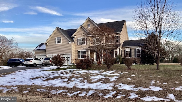 view of front of house with aphalt driveway and an attached garage