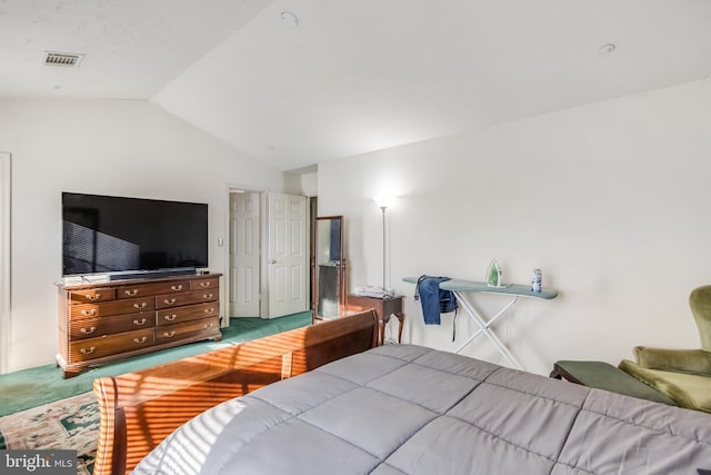 carpeted bedroom featuring lofted ceiling