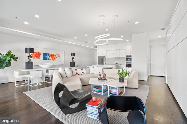 living room featuring dark hardwood / wood-style flooring