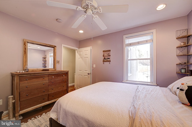 bedroom featuring ceiling fan and dark hardwood / wood-style floors