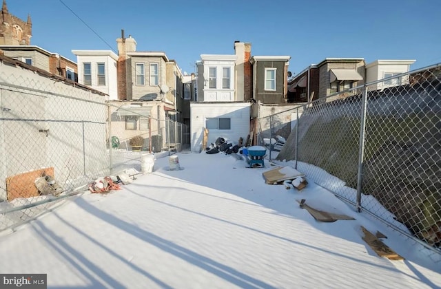 view of yard layered in snow