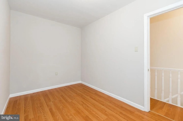 spare room featuring hardwood / wood-style floors