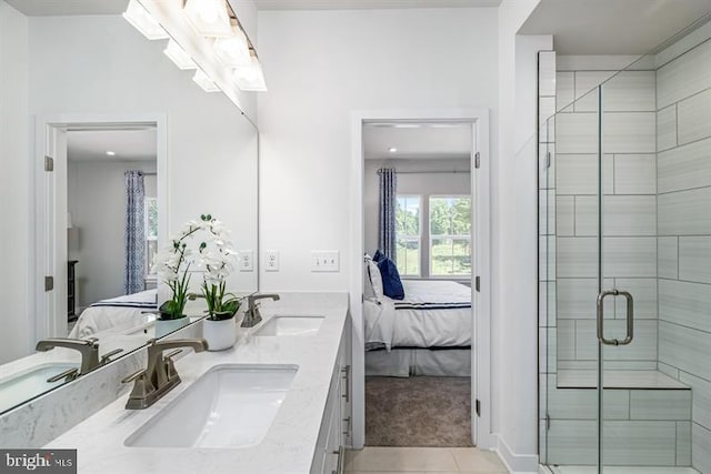 bathroom featuring walk in shower, tile patterned floors, and vanity