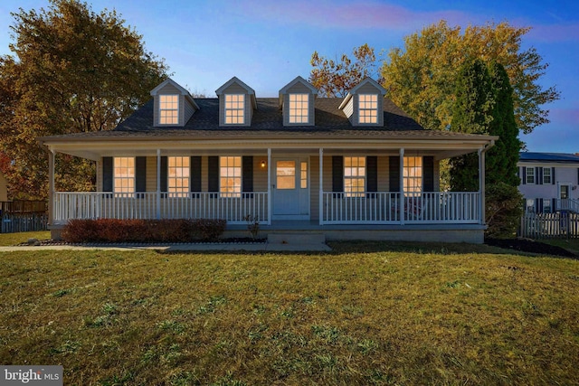 view of front facade with a yard and a porch