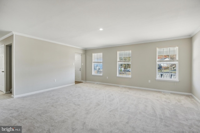 carpeted empty room with ornamental molding