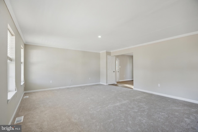 carpeted empty room featuring ornamental molding