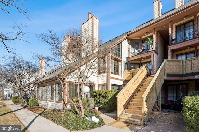 view of property featuring stairs