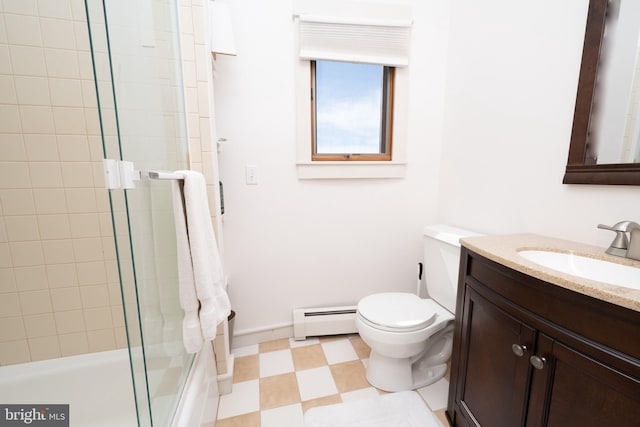 bathroom with vanity, toilet, and baseboard heating