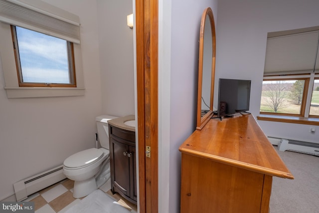 bathroom with vanity, a baseboard radiator, and toilet