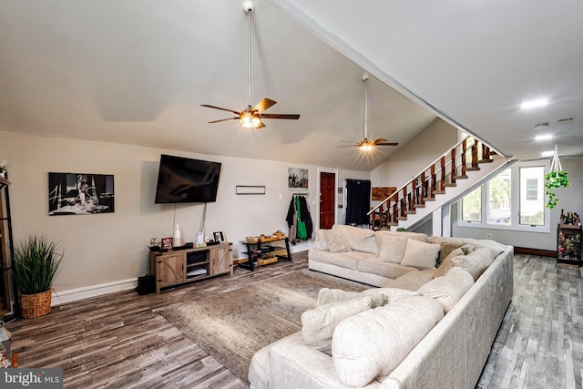 living room with vaulted ceiling, ceiling fan, and dark hardwood / wood-style flooring