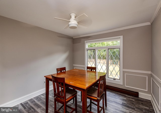 dining space featuring ceiling fan, dark hardwood / wood-style floors, and ornamental molding