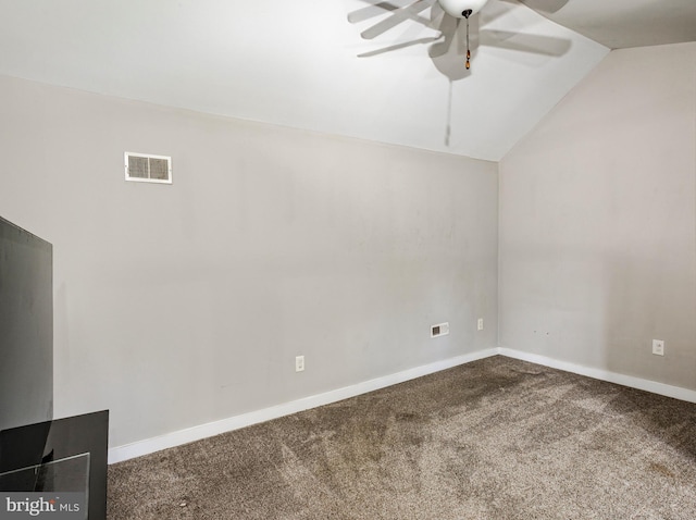 unfurnished room featuring carpet floors, lofted ceiling, and ceiling fan