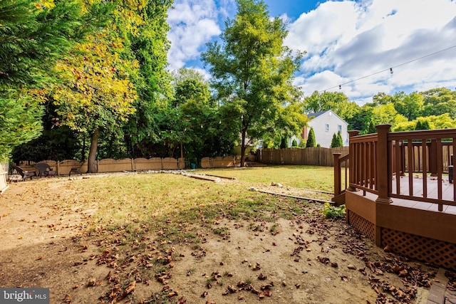 view of yard featuring a wooden deck