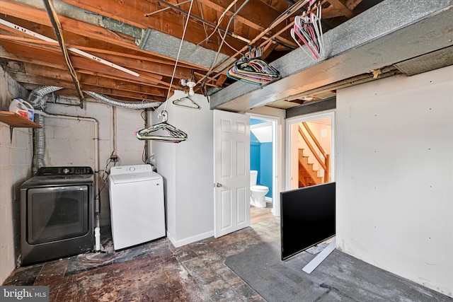 washroom featuring washing machine and dryer