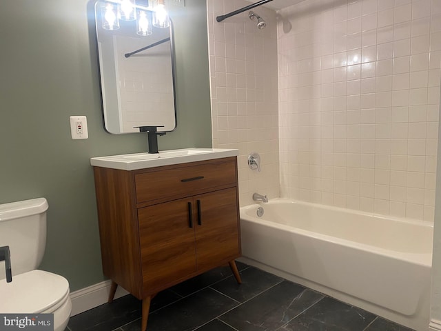 full bathroom with tiled shower / bath combo, toilet, tile patterned flooring, and vanity