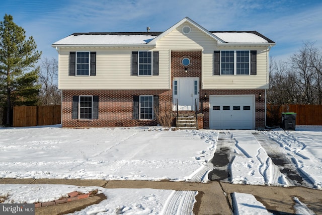 split foyer home featuring a garage