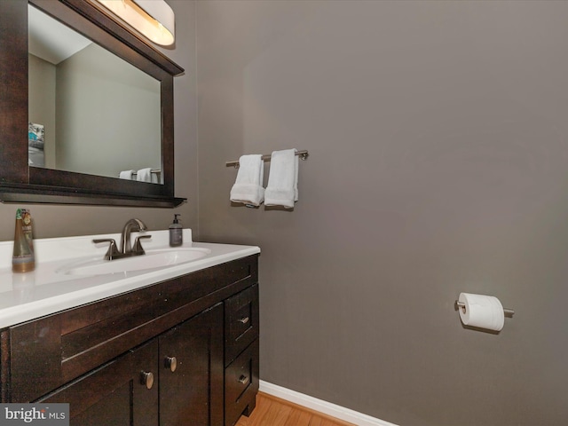 bathroom featuring hardwood / wood-style flooring and vanity