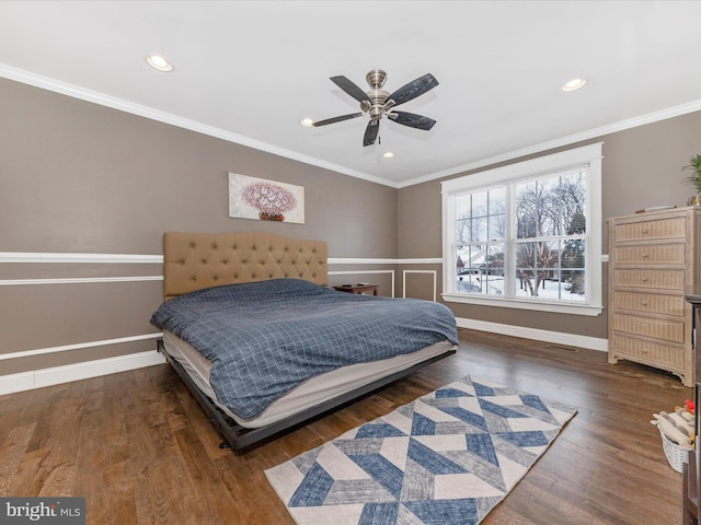 bedroom featuring ceiling fan, ornamental molding, and dark hardwood / wood-style floors