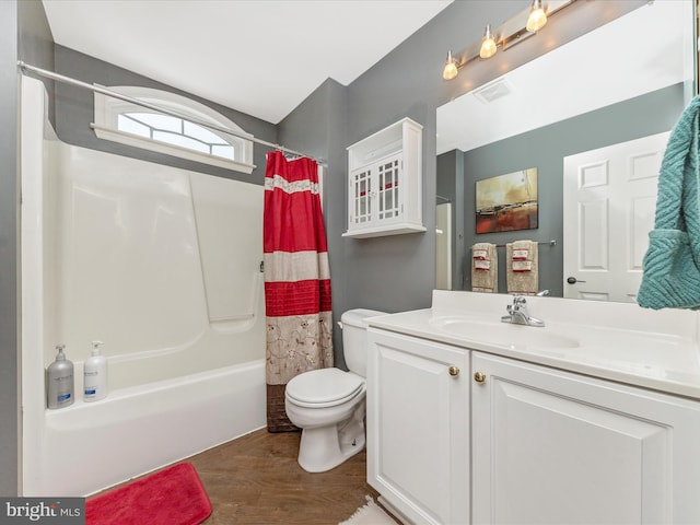 full bathroom featuring hardwood / wood-style flooring, toilet, vanity, and shower / bath combo