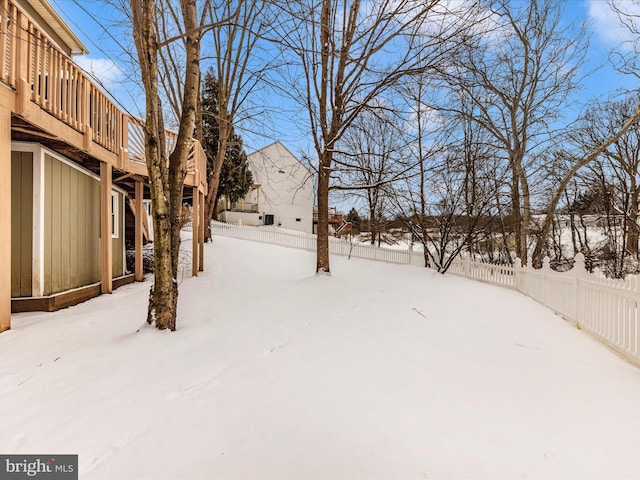 view of yard covered in snow