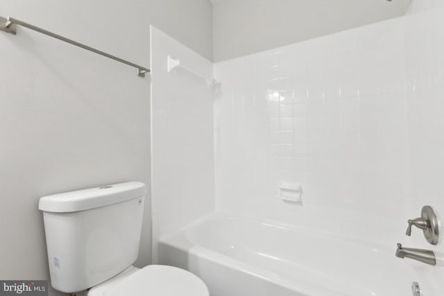 bathroom featuring toilet and shower / bathing tub combination