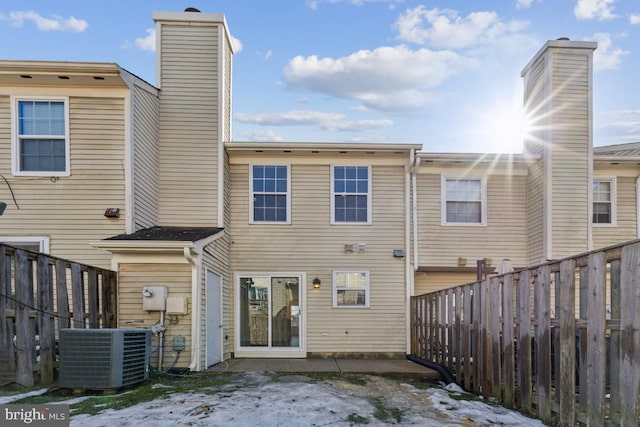 back of property with central AC unit