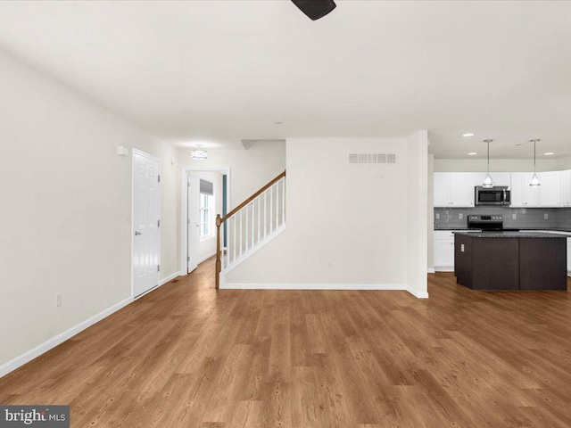 unfurnished living room featuring light hardwood / wood-style floors