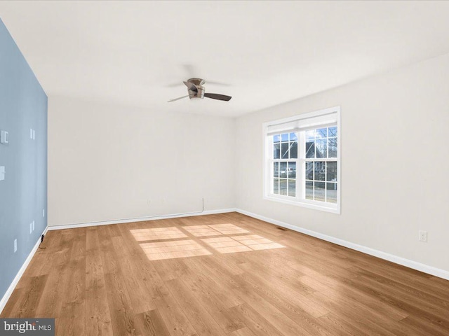 unfurnished room with ceiling fan and light hardwood / wood-style flooring