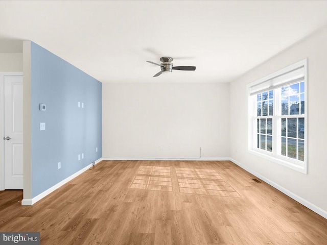 spare room with ceiling fan and light hardwood / wood-style flooring