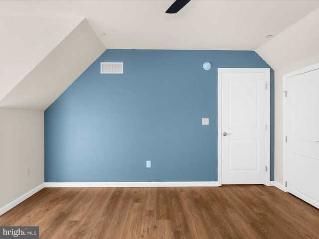 bonus room featuring wood-type flooring, vaulted ceiling, and ceiling fan