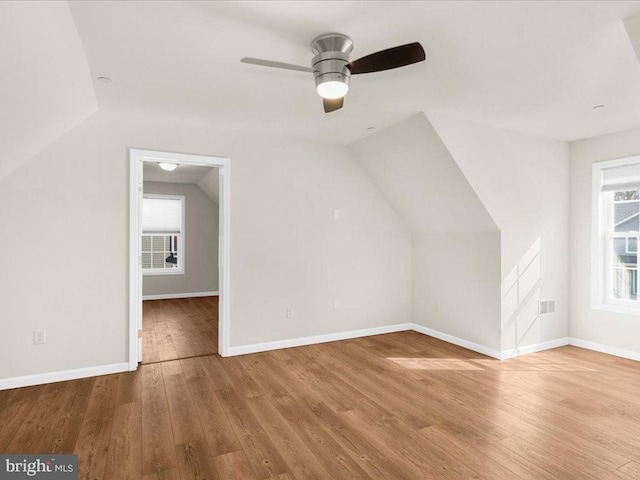 bonus room featuring ceiling fan, lofted ceiling, and light hardwood / wood-style floors