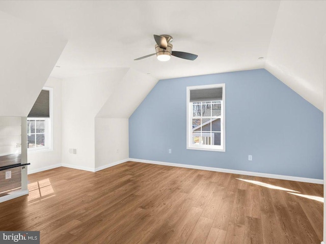 bonus room with lofted ceiling, hardwood / wood-style flooring, and ceiling fan