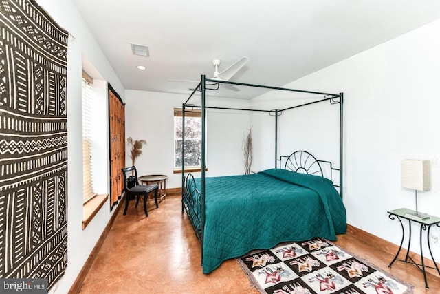 bedroom with baseboards, ceiling fan, visible vents, and finished concrete floors