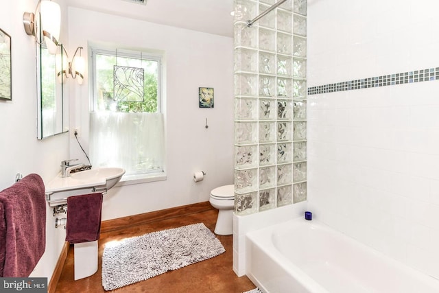 bathroom with baseboards, a sink, visible vents, and toilet