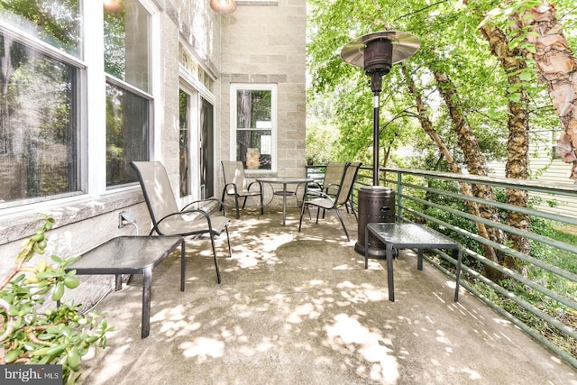 view of patio / terrace with outdoor dining space and a balcony