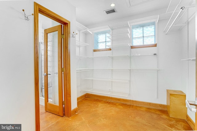 spacious closet featuring visible vents